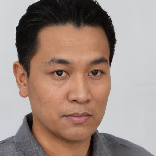 Neutral asian young-adult male with short  black hair and brown eyes