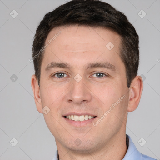 Joyful white young-adult male with short  brown hair and brown eyes