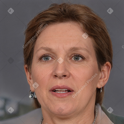 Joyful white adult female with short  brown hair and grey eyes