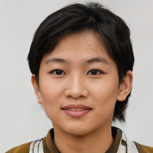 Joyful asian young-adult female with short  brown hair and brown eyes