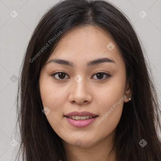 Joyful asian young-adult female with long  brown hair and brown eyes