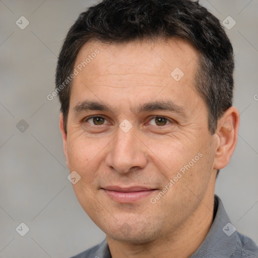 Joyful white adult male with short  brown hair and brown eyes