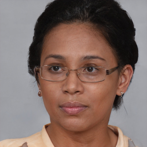 Joyful asian adult female with short  brown hair and brown eyes