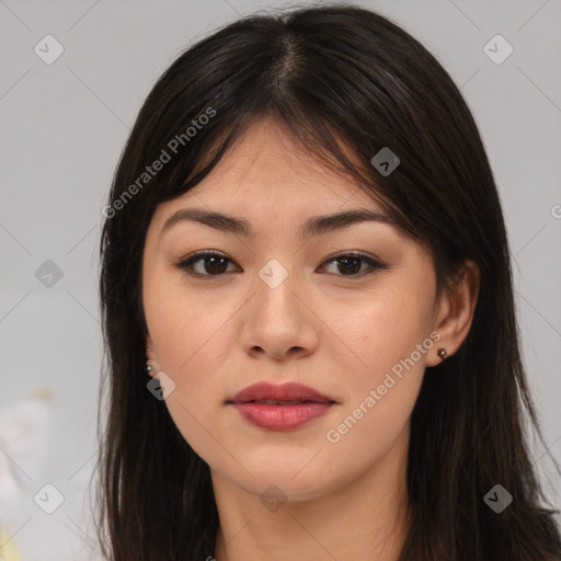 Joyful asian young-adult female with long  brown hair and brown eyes