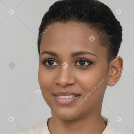 Joyful black young-adult female with short  black hair and brown eyes