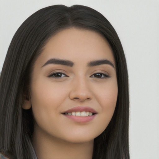 Joyful asian young-adult female with long  brown hair and brown eyes