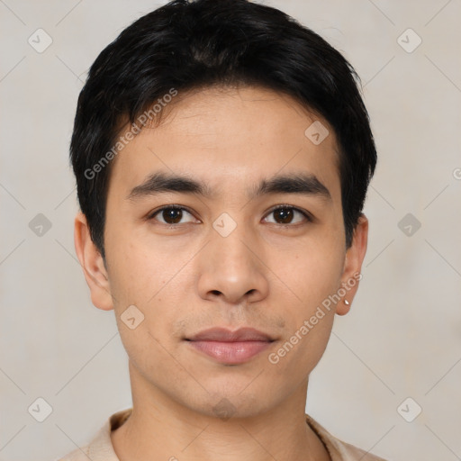 Joyful asian young-adult male with short  black hair and brown eyes