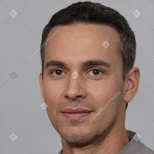 Joyful white young-adult male with short  black hair and brown eyes