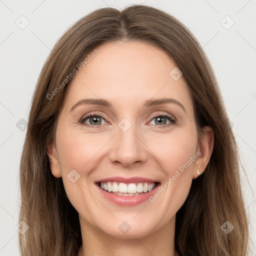 Joyful white young-adult female with long  brown hair and grey eyes