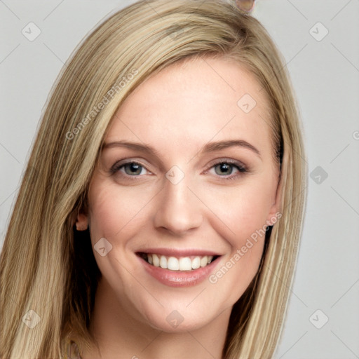 Joyful white young-adult female with long  brown hair and blue eyes