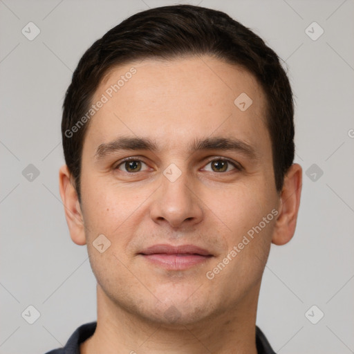 Joyful white young-adult male with short  brown hair and brown eyes