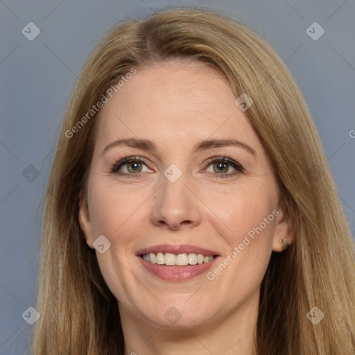 Joyful white adult female with long  brown hair and brown eyes