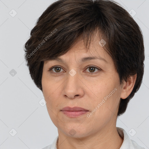 Joyful white adult female with short  brown hair and brown eyes