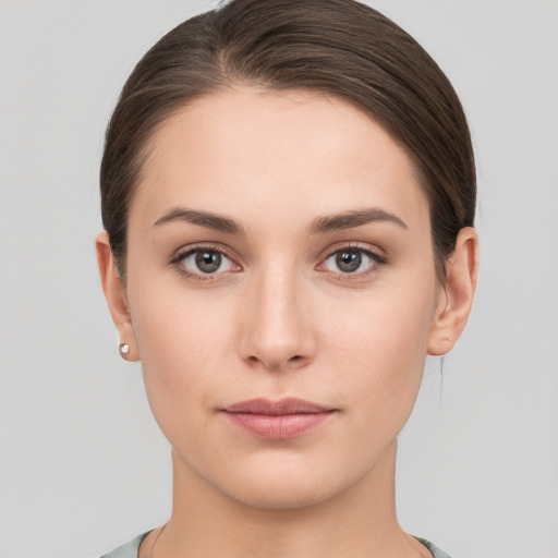 Neutral white young-adult female with short  brown hair and brown eyes