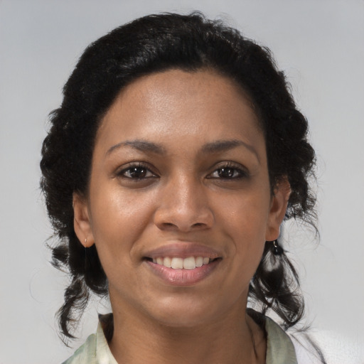 Joyful latino young-adult female with medium  brown hair and brown eyes
