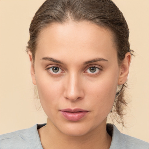 Neutral white young-adult female with medium  brown hair and brown eyes