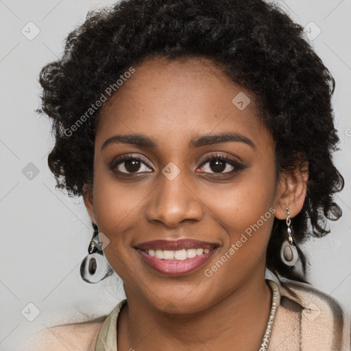 Joyful black young-adult female with long  black hair and brown eyes