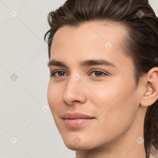 Joyful white young-adult male with medium  brown hair and brown eyes