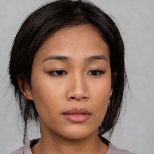 Neutral asian young-adult female with medium  brown hair and brown eyes