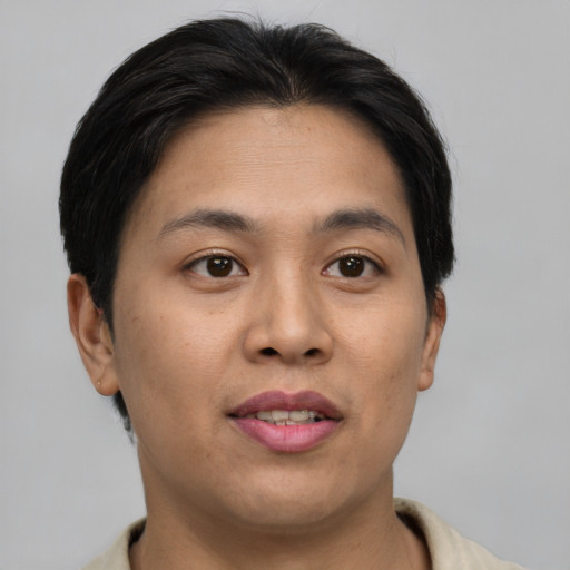 Joyful asian young-adult female with short  brown hair and brown eyes