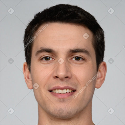 Joyful white young-adult male with short  brown hair and brown eyes