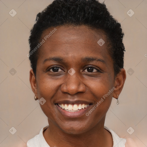 Joyful black young-adult female with short  brown hair and brown eyes