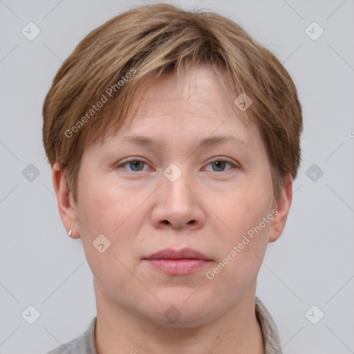 Joyful white adult female with short  brown hair and grey eyes