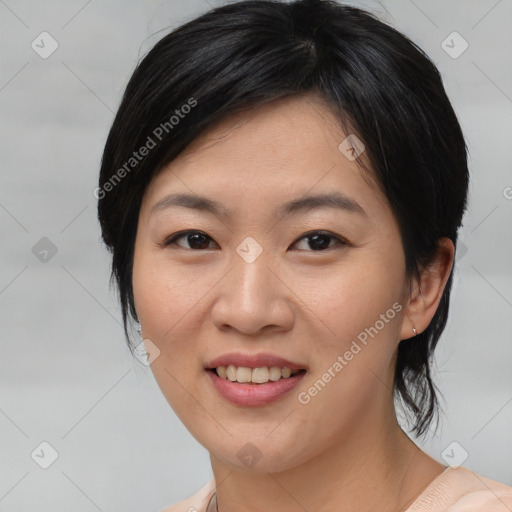 Joyful asian young-adult female with medium  black hair and brown eyes