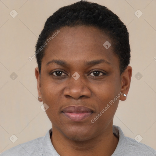 Joyful black young-adult female with short  black hair and brown eyes