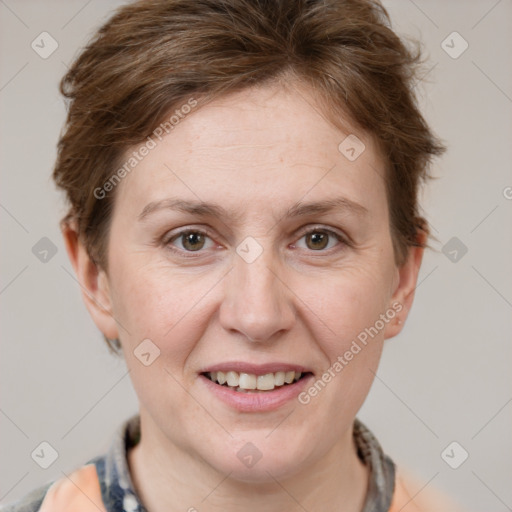 Joyful white adult female with short  brown hair and grey eyes