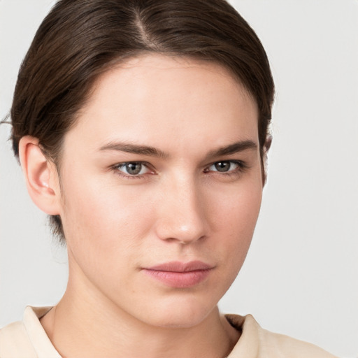 Neutral white young-adult female with short  brown hair and brown eyes