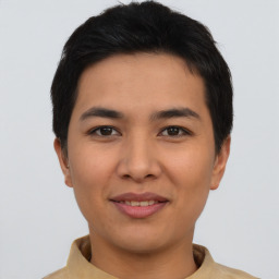 Joyful asian young-adult male with short  black hair and brown eyes