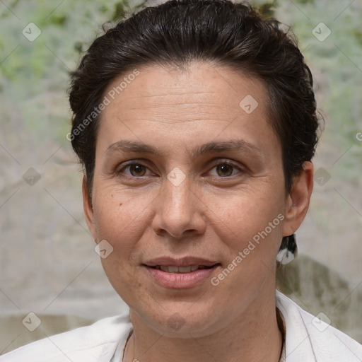 Joyful white adult female with short  brown hair and brown eyes