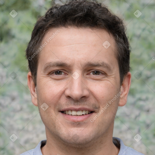 Joyful white adult male with short  brown hair and brown eyes