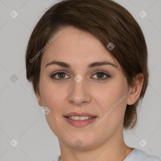 Joyful white young-adult female with medium  brown hair and green eyes