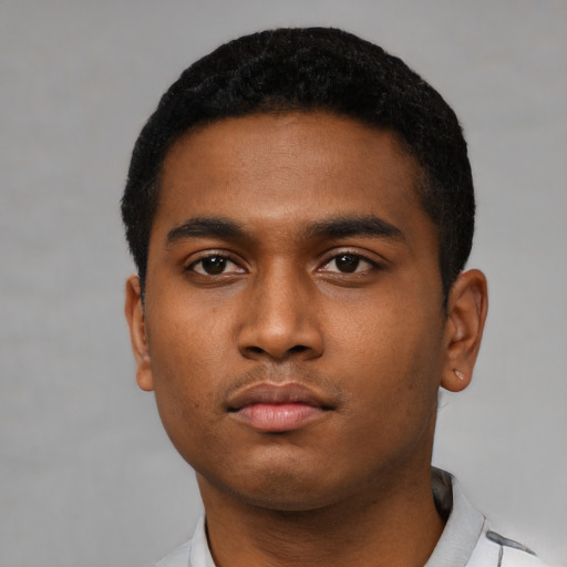 Neutral latino young-adult male with short  black hair and brown eyes
