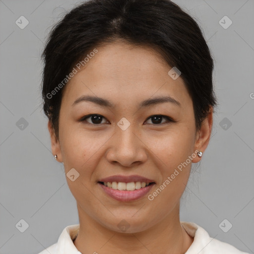 Joyful asian young-adult female with short  brown hair and brown eyes