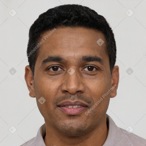 Joyful latino young-adult male with short  black hair and brown eyes