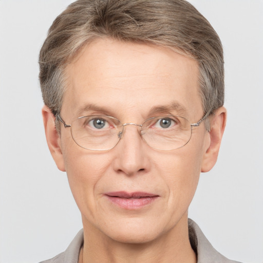 Joyful white adult male with short  brown hair and grey eyes