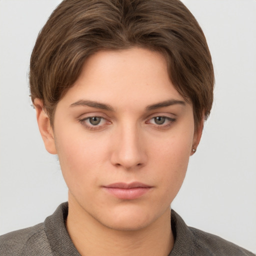 Neutral white young-adult female with short  brown hair and grey eyes