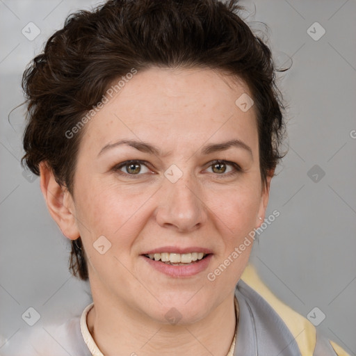 Joyful white adult female with short  brown hair and brown eyes