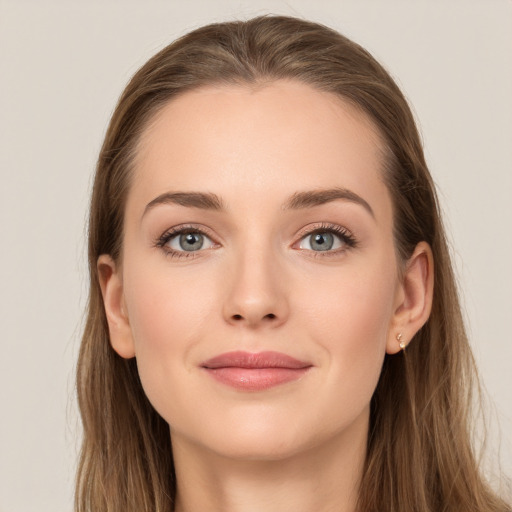 Joyful white young-adult female with long  brown hair and grey eyes