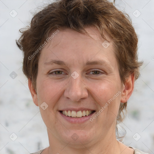 Joyful white adult female with short  brown hair and grey eyes