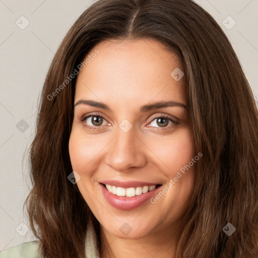 Joyful white young-adult female with long  brown hair and green eyes