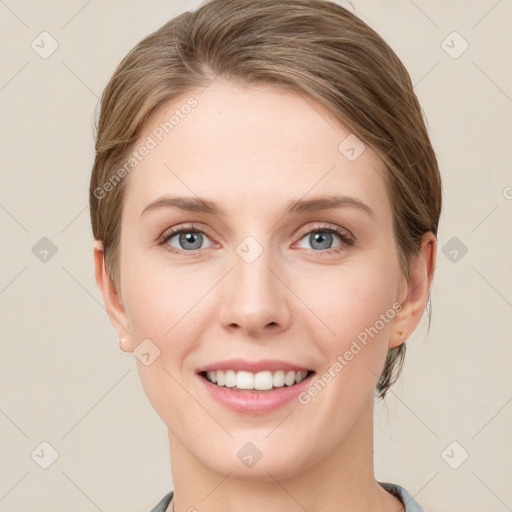 Joyful white young-adult female with short  brown hair and grey eyes