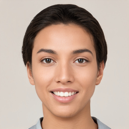 Joyful white young-adult female with short  brown hair and brown eyes