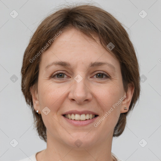 Joyful white adult female with medium  brown hair and grey eyes