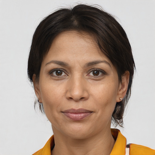 Joyful white adult female with medium  brown hair and brown eyes