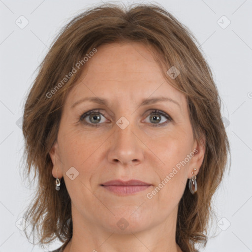 Joyful white adult female with medium  brown hair and grey eyes