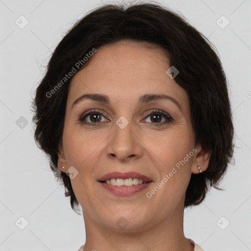 Joyful white adult female with medium  brown hair and brown eyes